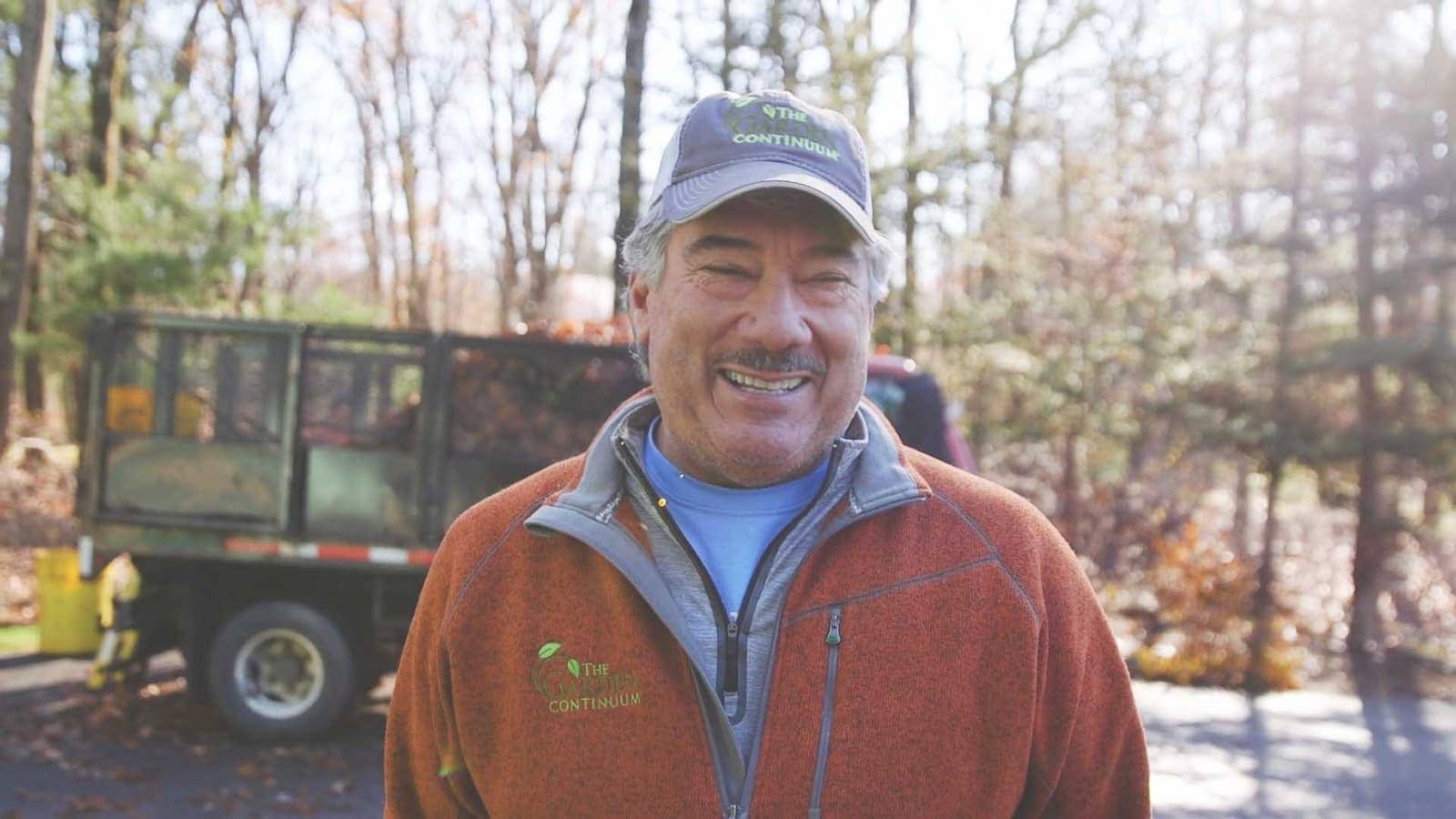 Man standing outside by a work truck